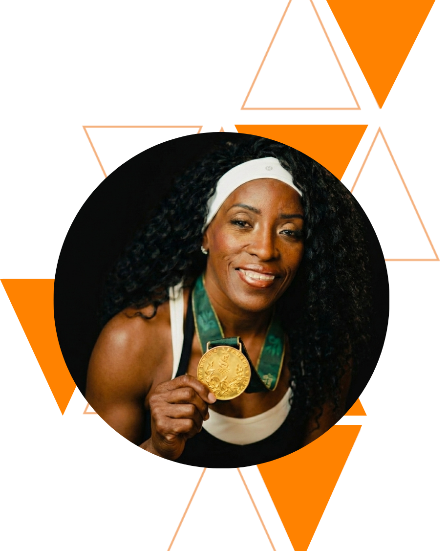 Ruthie Bolton, Olympic medalist, holding her gold medal